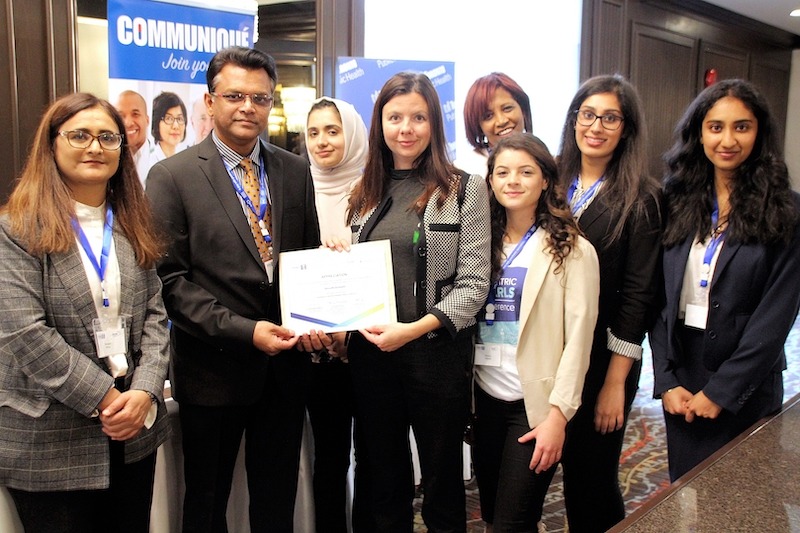 Dr. Hamid presenting a certificate to participants