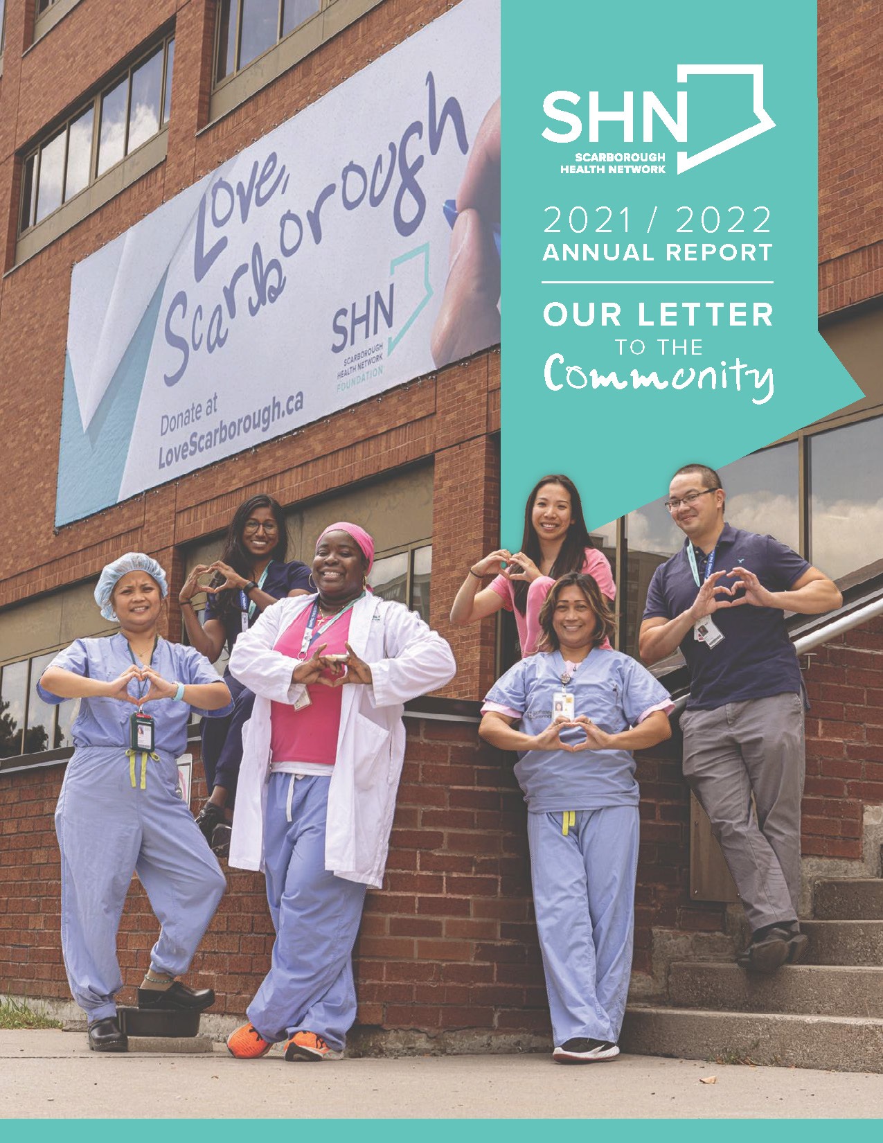 SHN staff forming a heart with their hands for the cover of SHN and SHN Foundation's 2021-2022 joint Annual Report