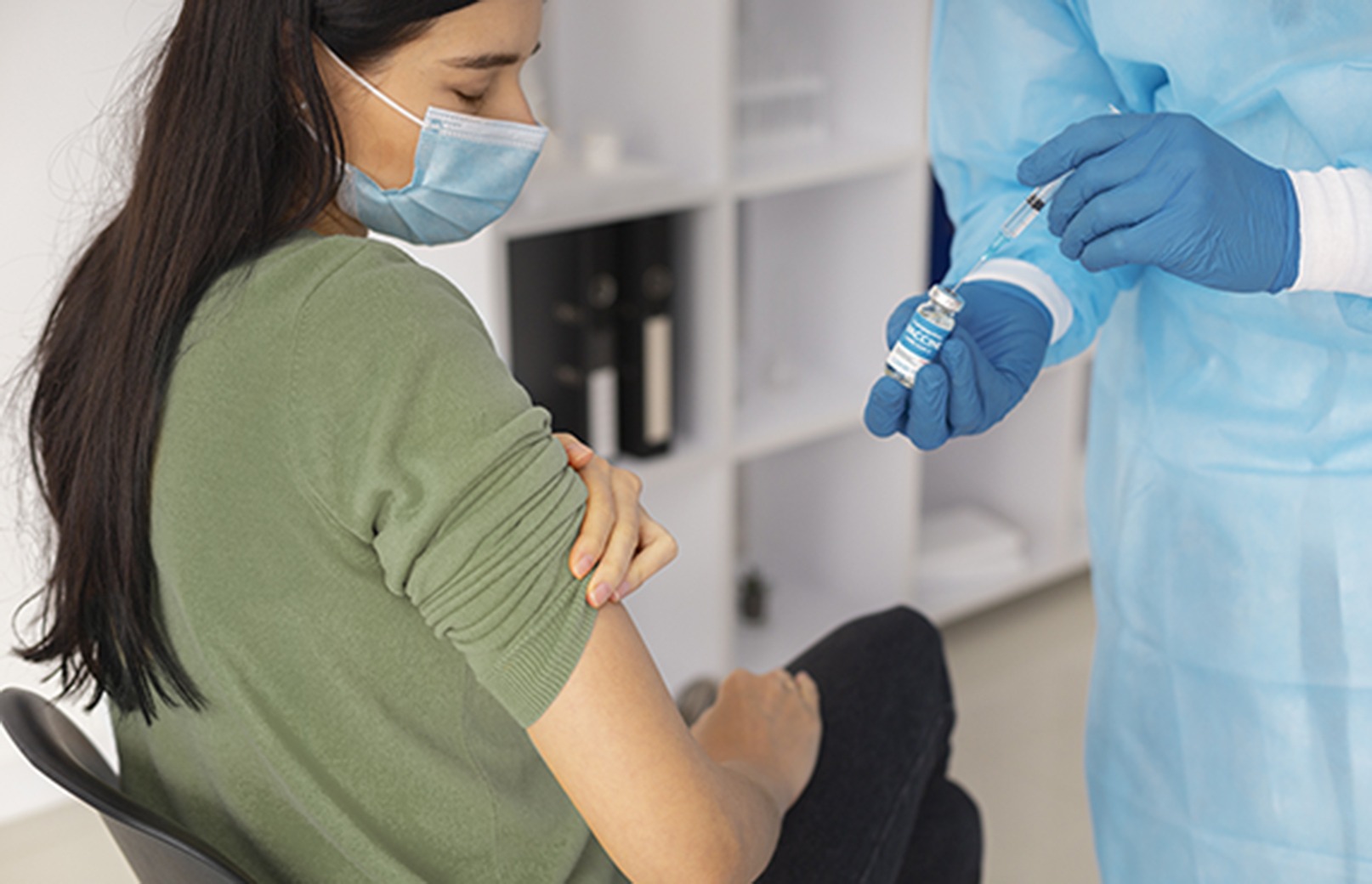 Female patient receiving COVID-19 vaccination